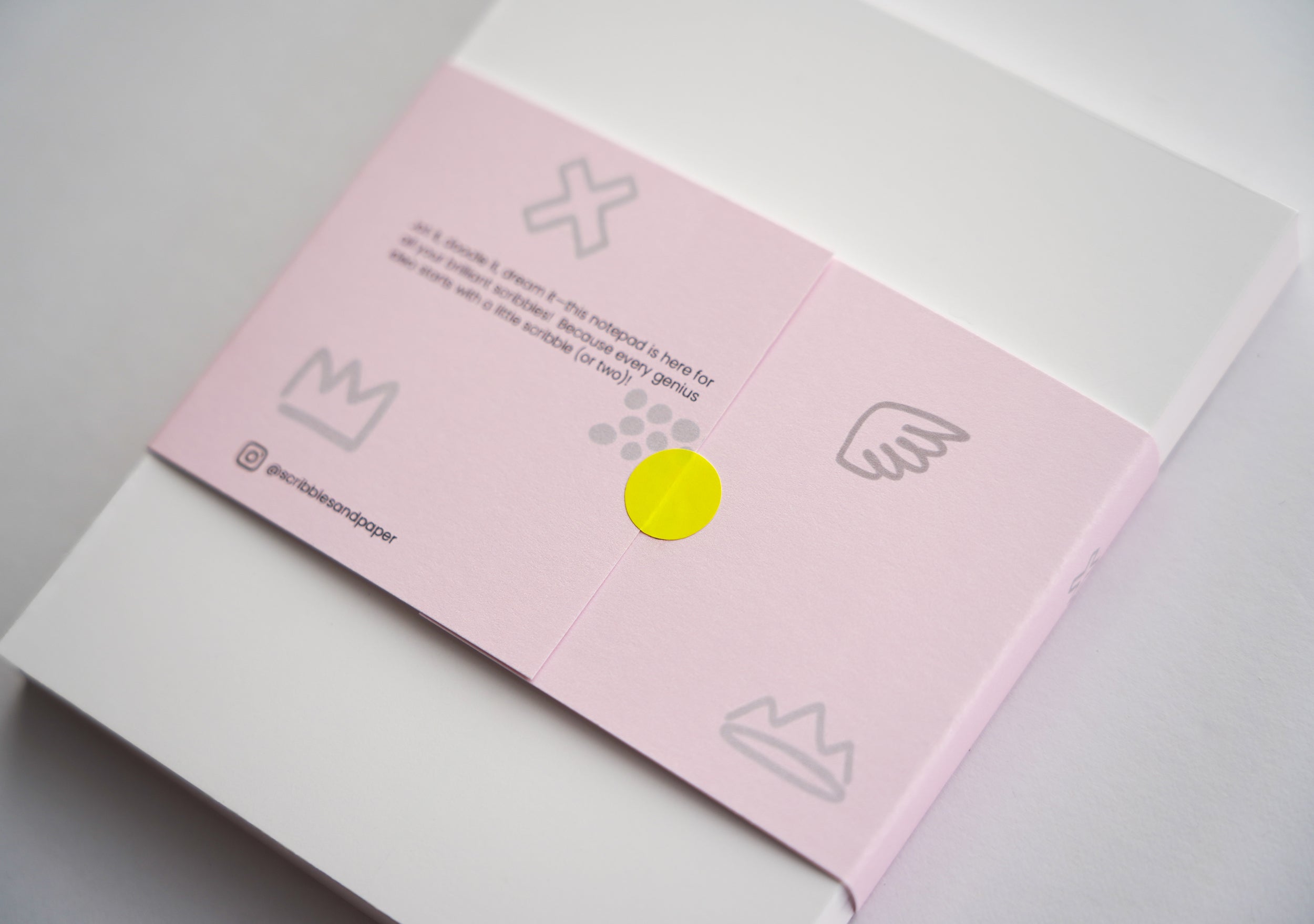 Modern pink notepad with graphic blue grid and notes heading – 100-page stationery. (back view)
