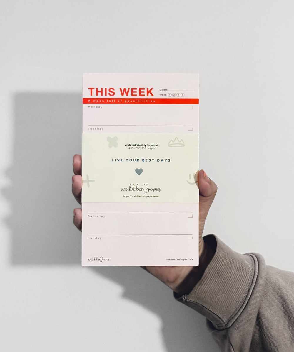 person holding notepad