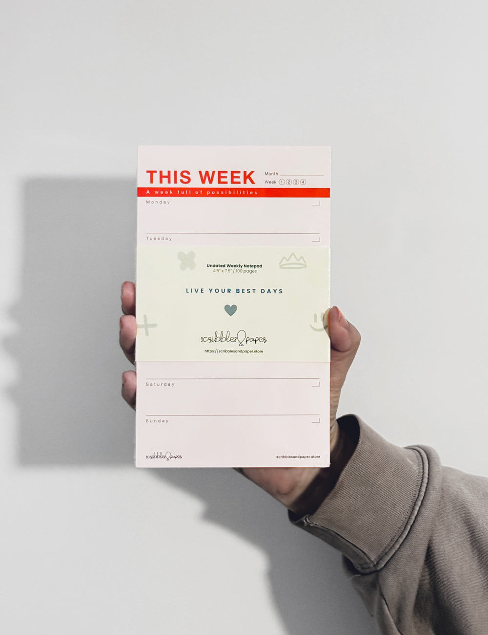 person holding notepad