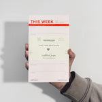 person holding notepad