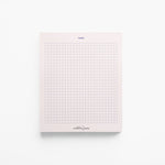 Modern pink notepad with graphic blue grid and notes heading – 100-page stationery. (front view)