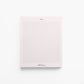 Modern pink notepad with graphic blue grid and notes heading – 100-page stationery. (front view)
