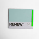Renew - Pantone-inspired greeting card in fresh green — great for wishing someone to get better soon, shown wrapped 