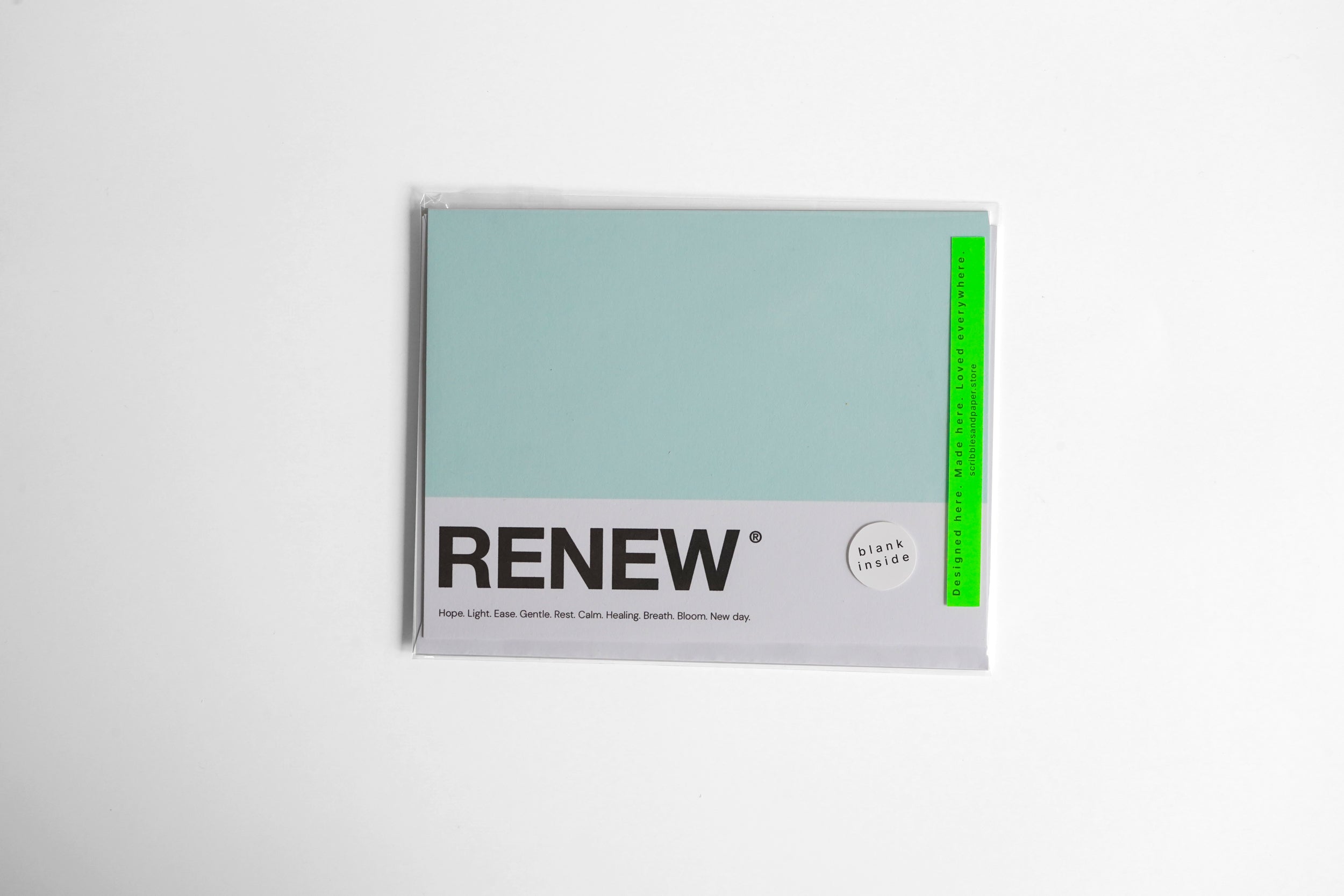 Renew - Pantone-inspired greeting card in fresh green — great for wishing someone to get better soon, shown wrapped 